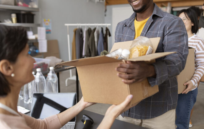 volunteer-collecting-donation-box-from-another-volunteer