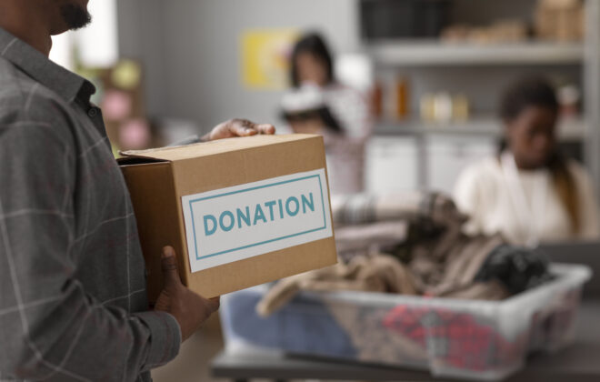 volunteer-helping-with-donation-box